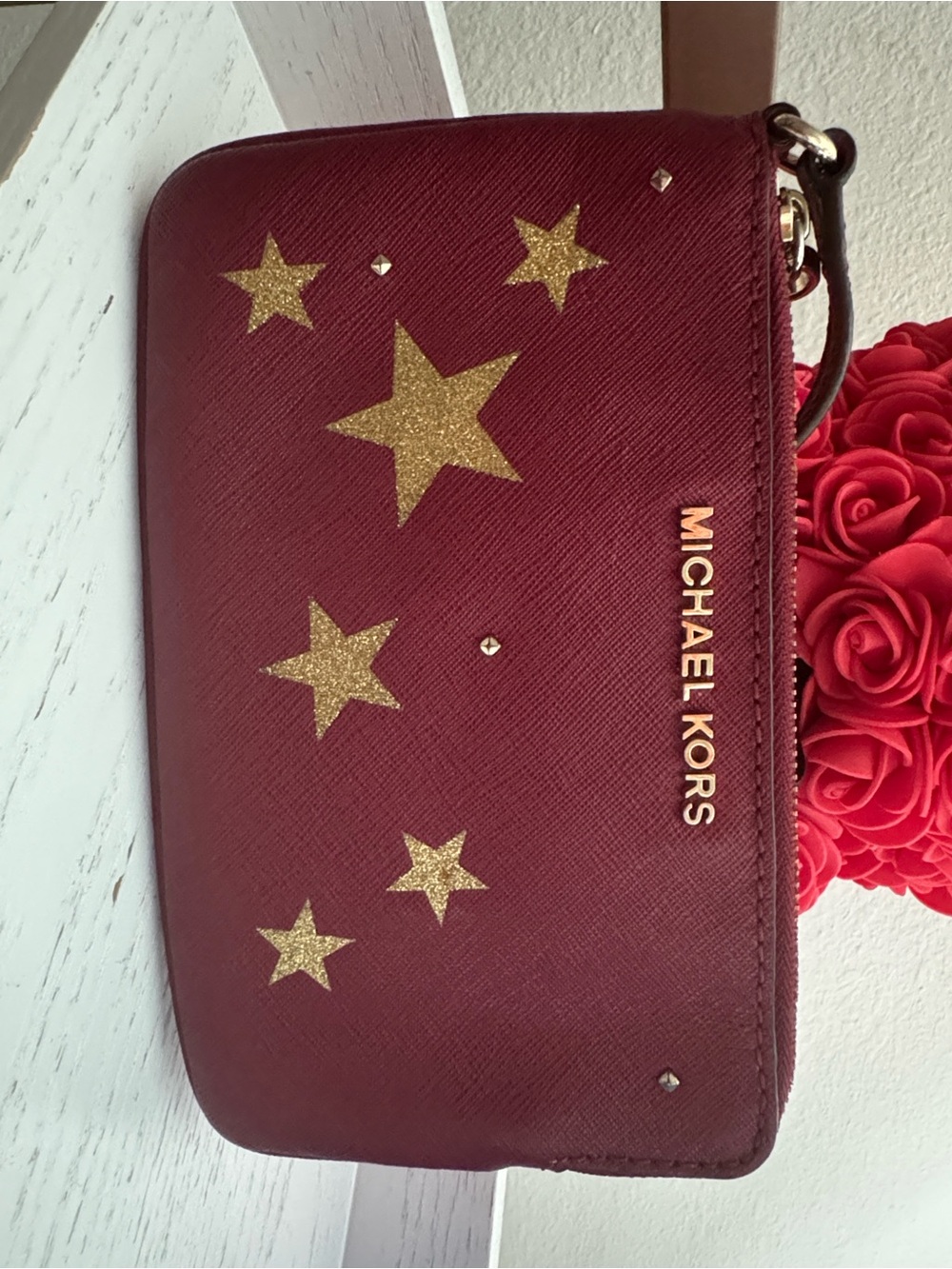 Michael Kors Burgundy Wristlet with Gold Star Details